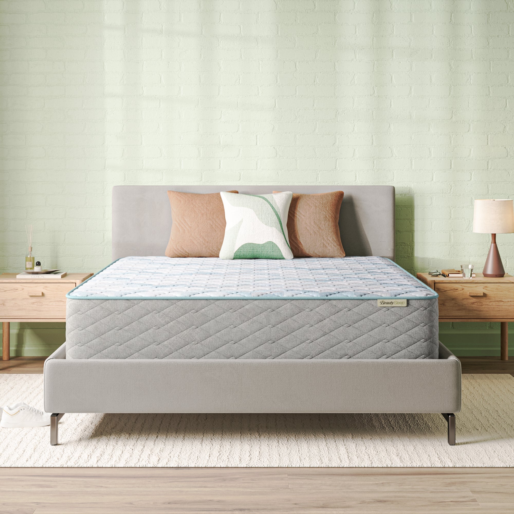 Beautysleep Mattress in a grey bedframe with 3 pillows on top of it within a bedroom setting