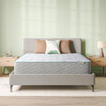 Beautysleep Mattress in a grey bedframe with 3 pillows on top of it within a bedroom setting