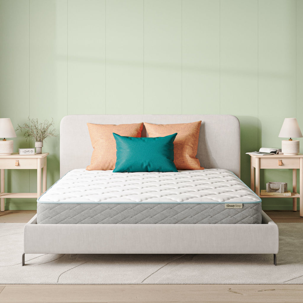 Beautysleep Mattress in a grey bedframe with 3 pillows on top of it within a bedroom setting