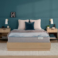 Beautysleep Mattress in a brown bedframe with 3 pillows on top of it within a bedroom setting
