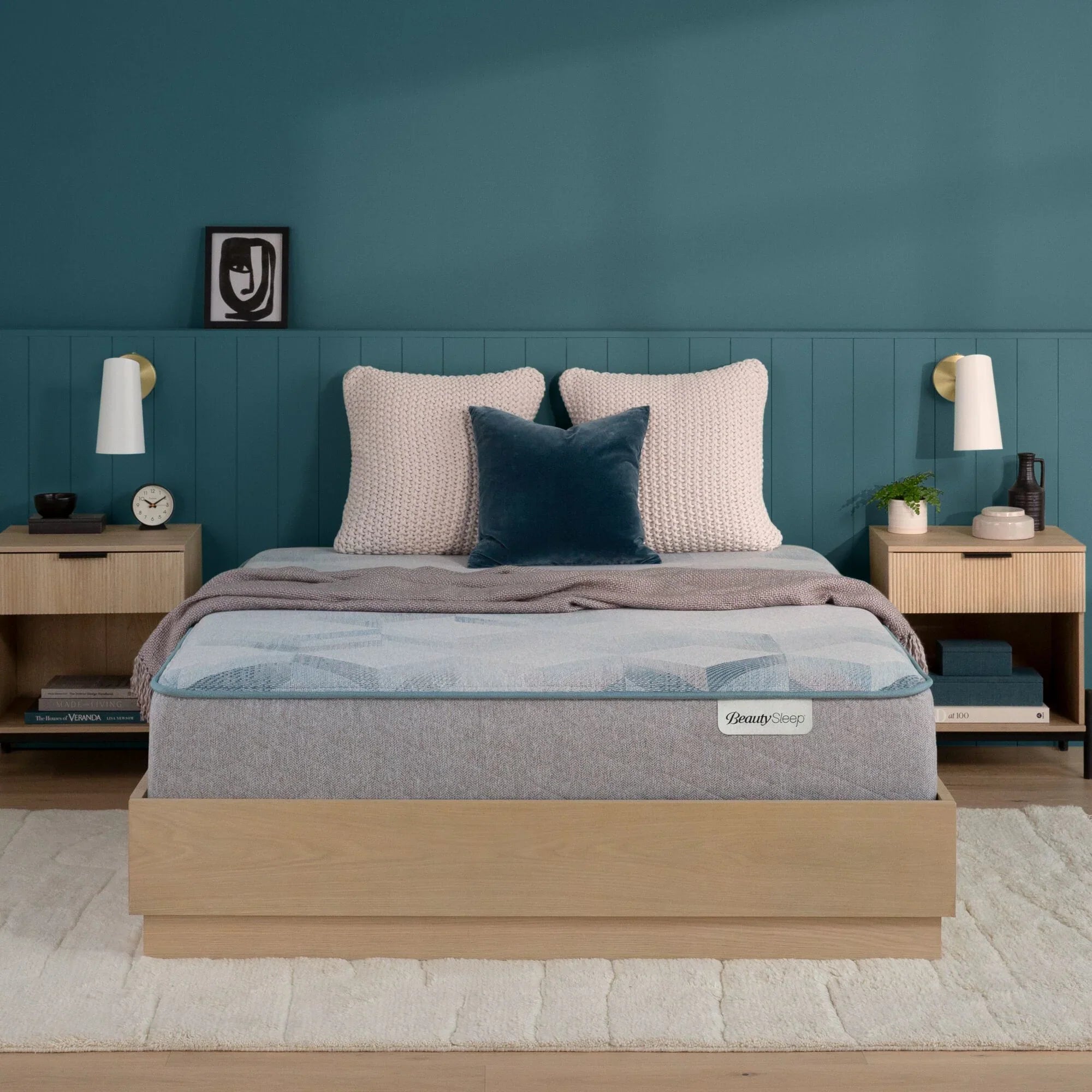Beautysleep Mattress in a brown bedframe with 3 pillows on top of it within a bedroom setting