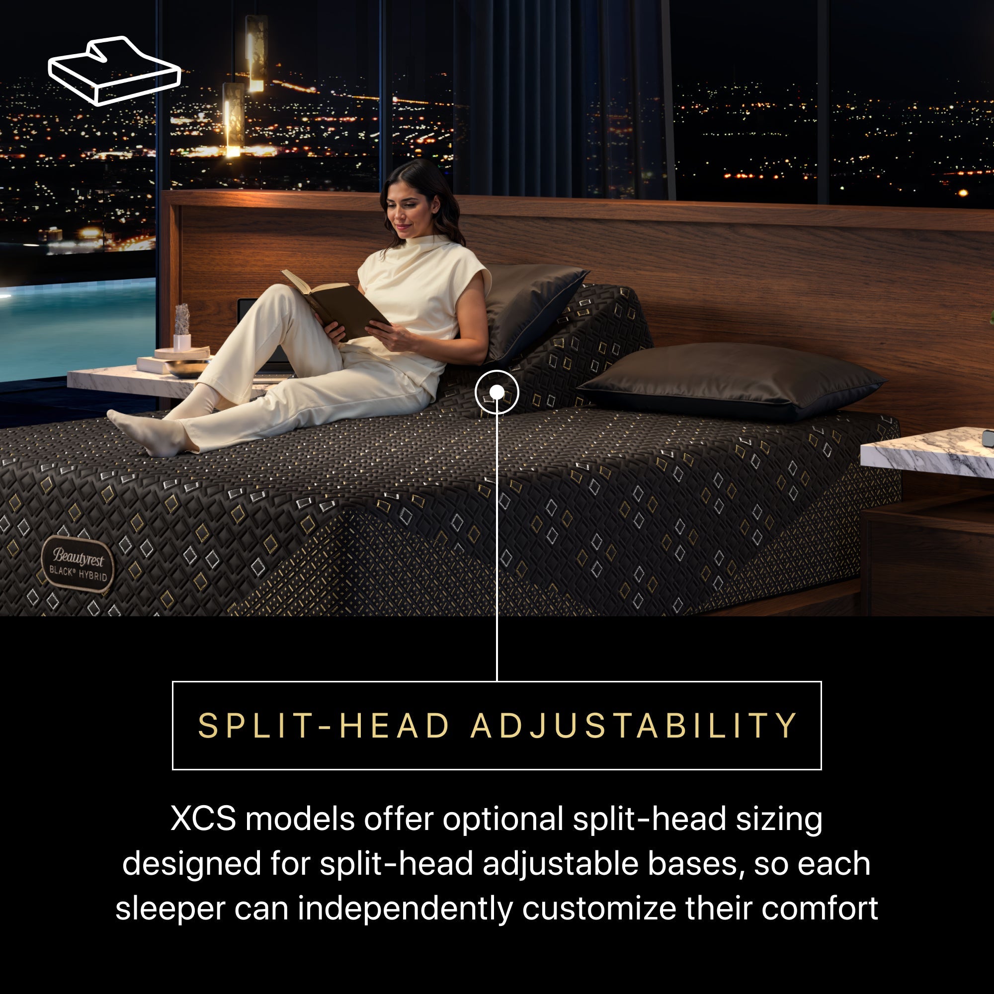 Woman reading a book on a split-head adjustable bed with a cityscape view.